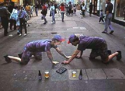 Artist Julian Beever, of the U.K.  One's real, the other's chalk.