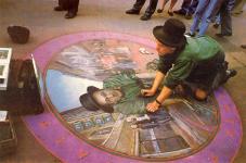 Artist Julian Beever, of the U.K.  One's real, the other's chalk.